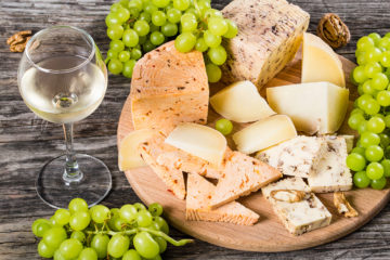 Cheese plate: goat cheese with walnuts, spices and grapes